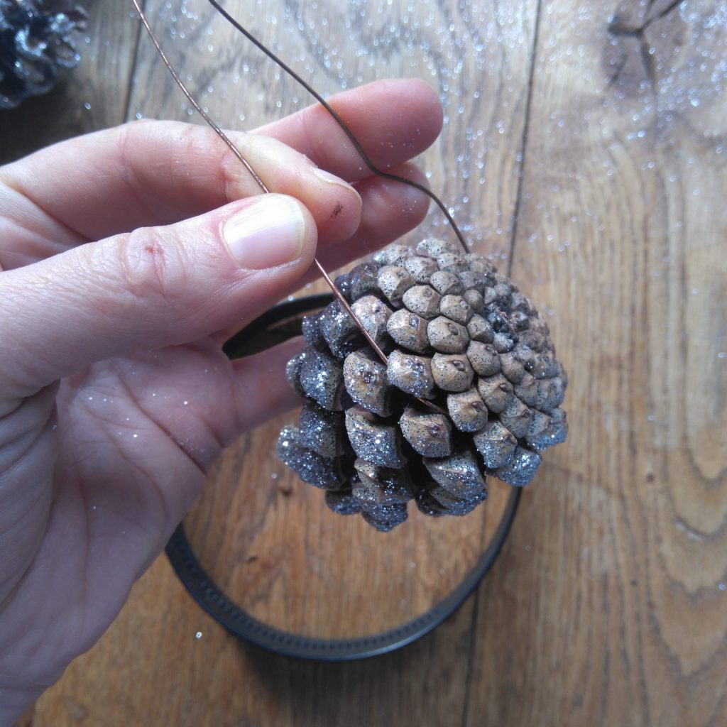 attach wire to the base of your pine cones diy tutorial woodland animal headbands from the awesome childhood project blog