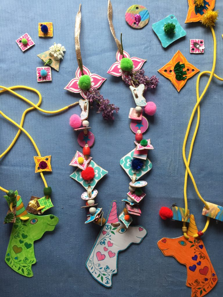 make recycled cardboard nature necklaces in rainbow colours with kids free unicorn craft printable