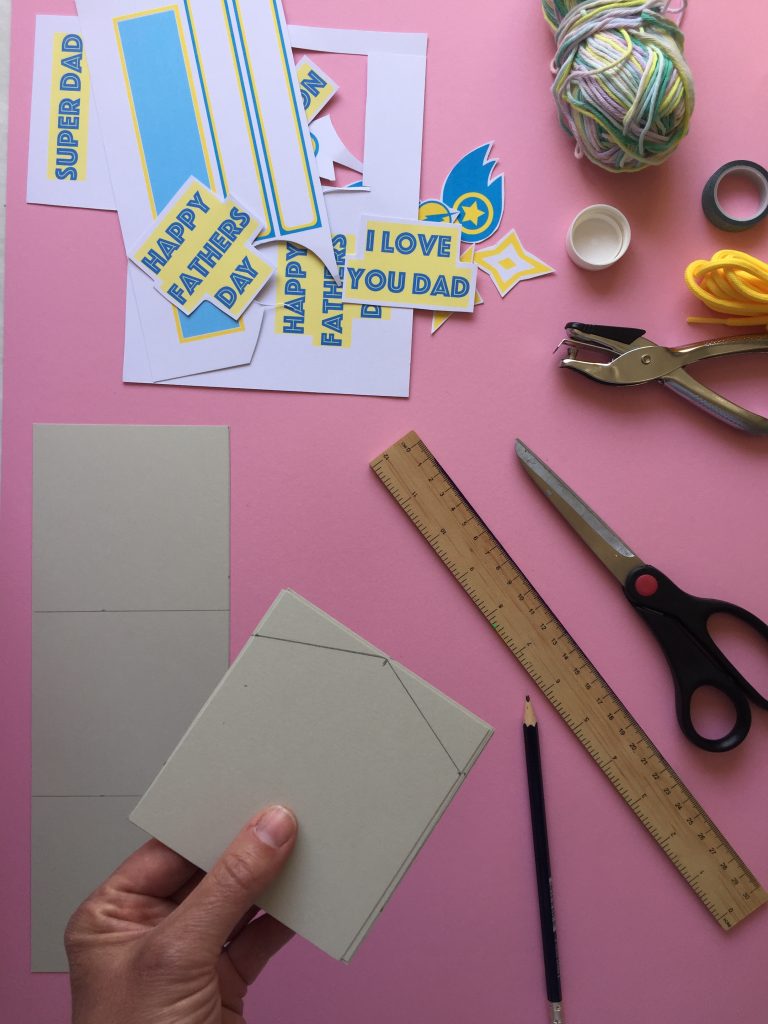 Cut pointy shapes to the bunting, to create your superhero themed kids homemade fathers day bunting