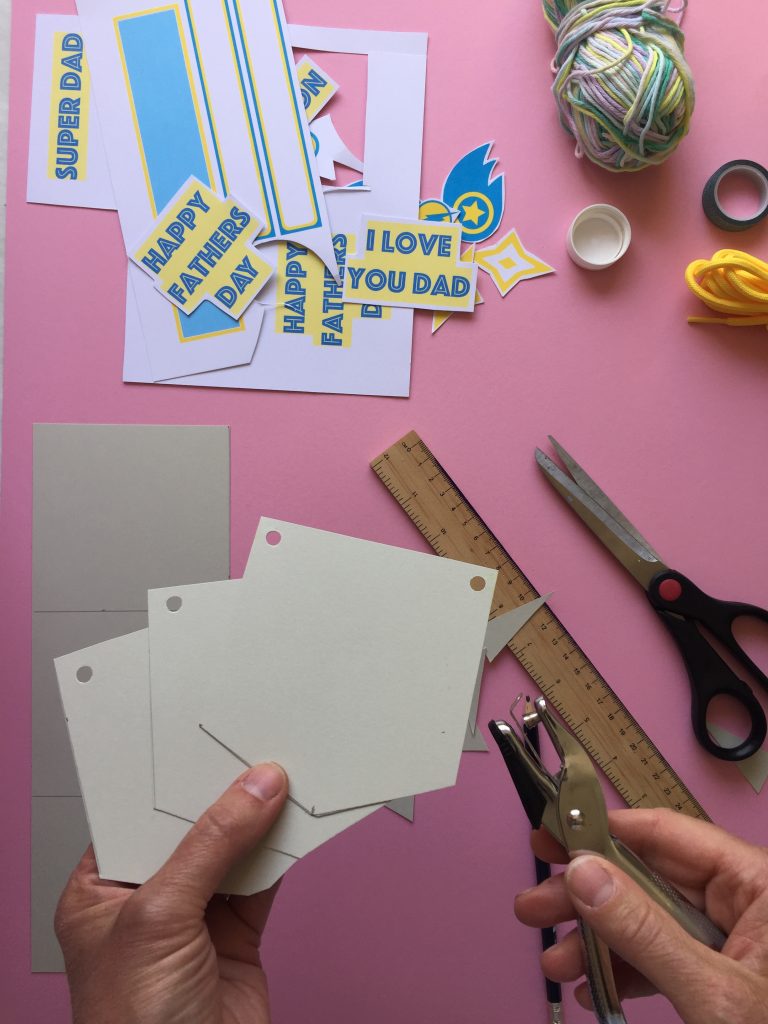 cut out your A4 card into six pieces, to create your superhero themed kids homemade fathers day bunting