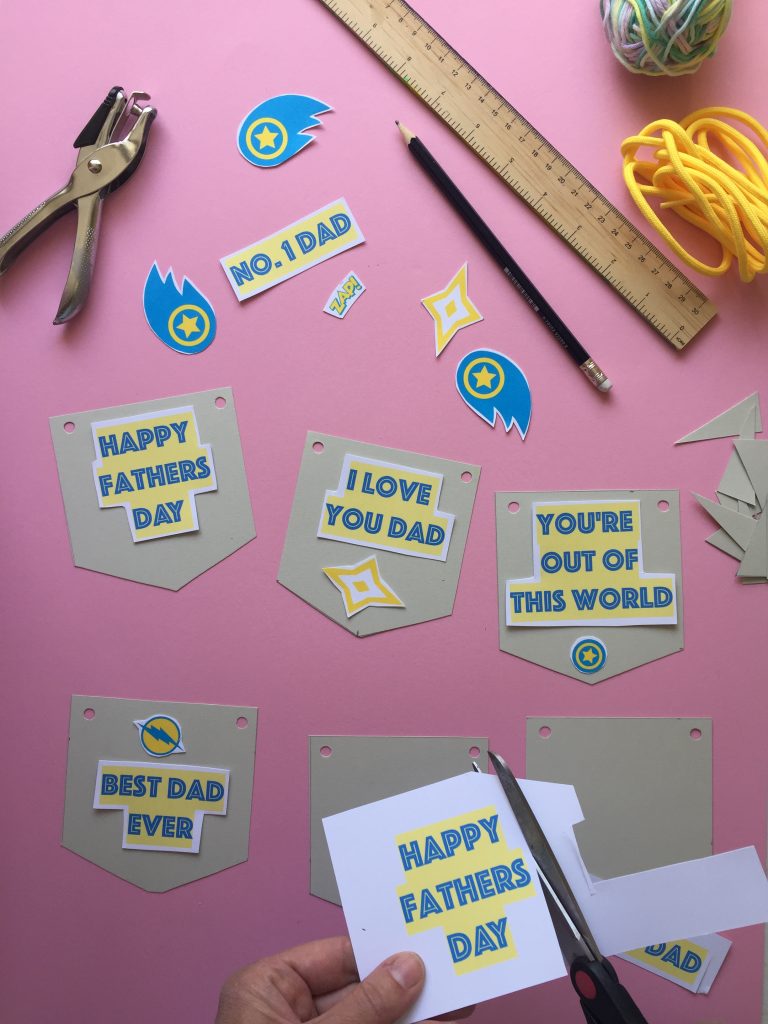 cut out the printable shapes to create your superhero themed kids homemade fathers day bunting