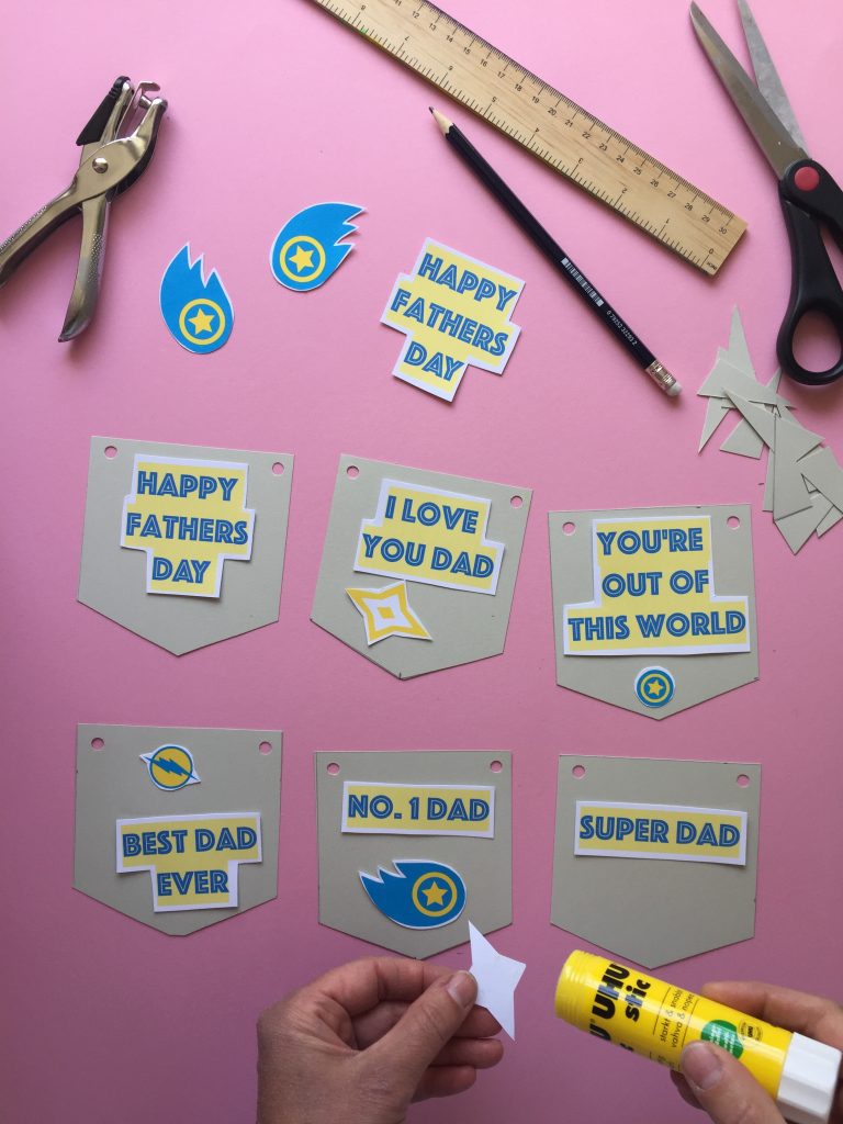 stick the shapes to the bunting to create your superhero themed kids homemade fathers day bunting