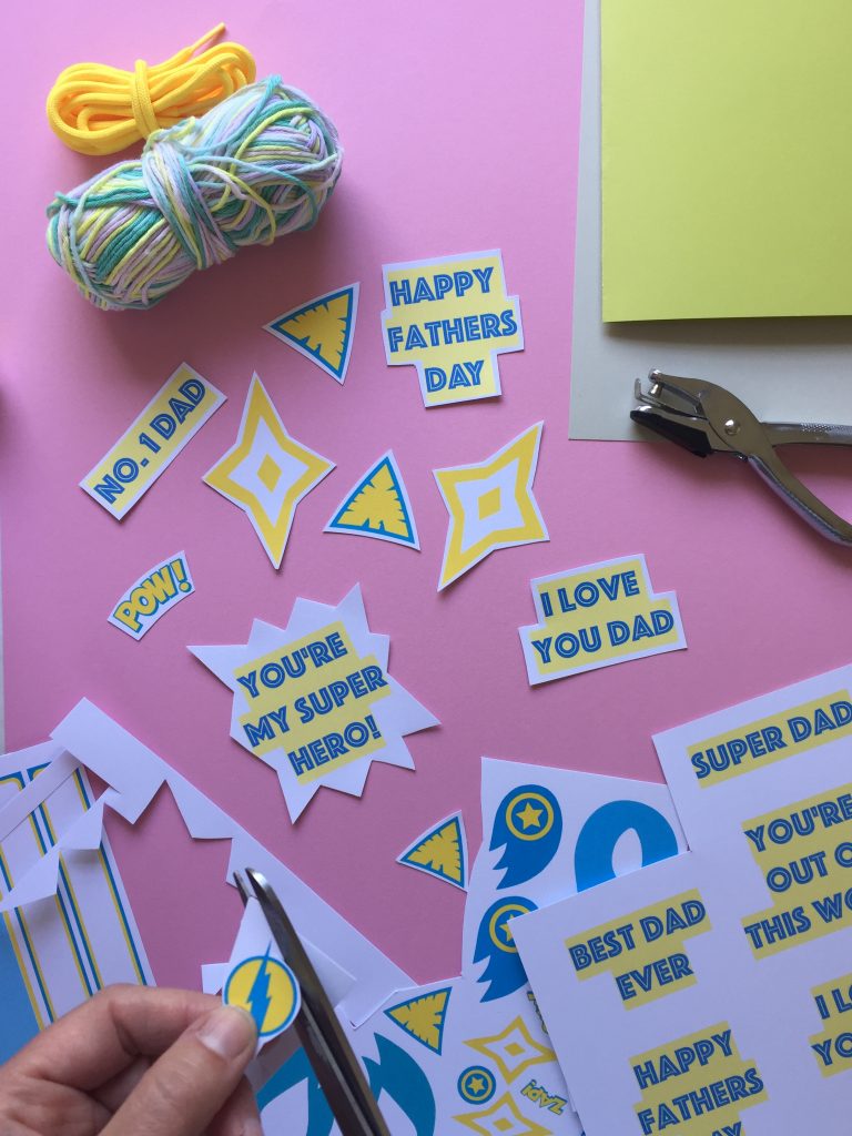 cut out the superhero shapes from our free printable and start creating your homemade fathers day card
