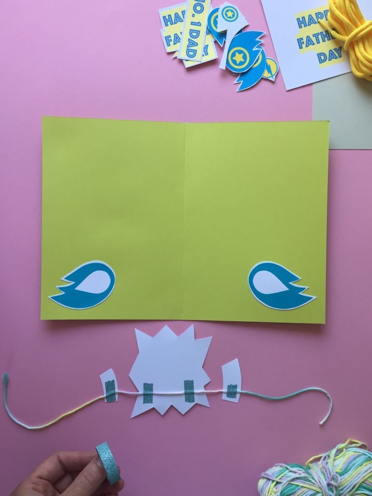 stick some cute super hero shapes to the string with cellotape on your homemade fathers day card to create the pop up effect