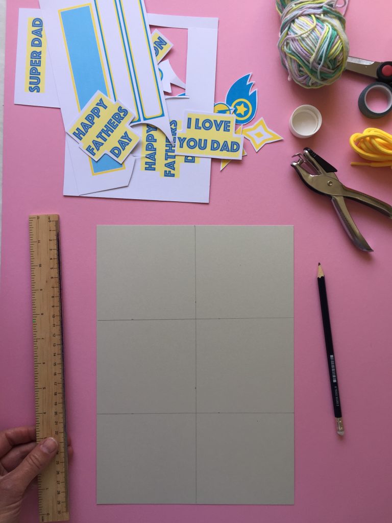 cut an A4 piece of card into six evenly sized bunting flag panels