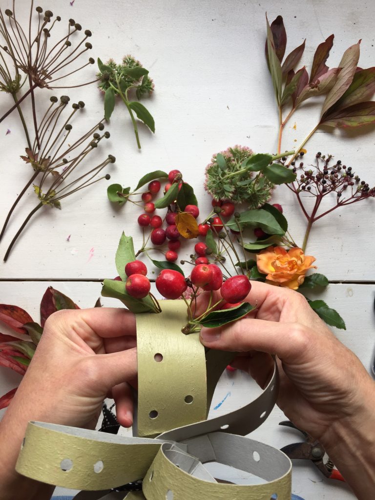 insert your gathered foliage into the holes in your card fascinator